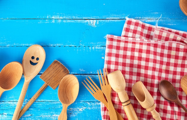 Many different wooden spoons, forks  