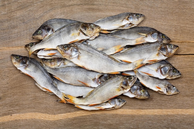 Many dried perch on a vintage wooden background