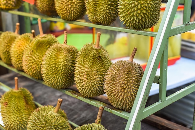 Many durian fruits on a stall in the Kuala Lumpur market
