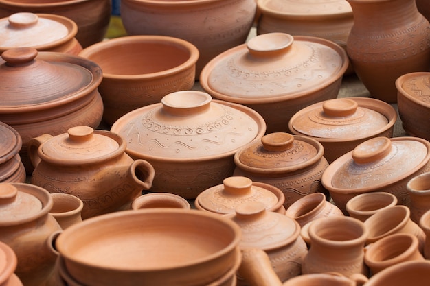 Many earthen pots kept for drying in the sun