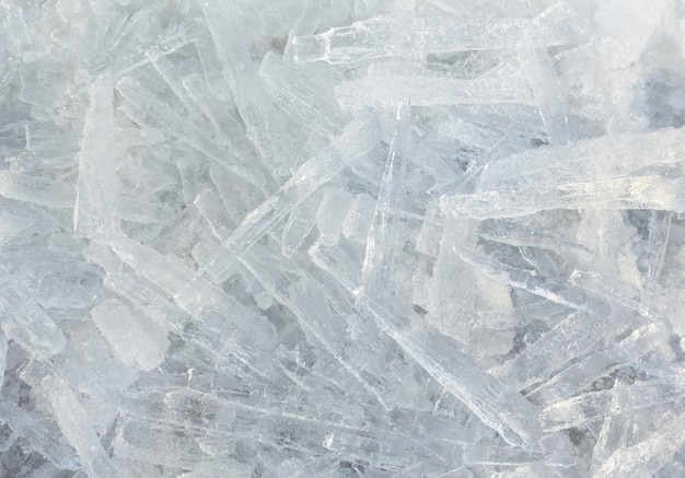 Many elongated pieces of ice closeup. Winter background.