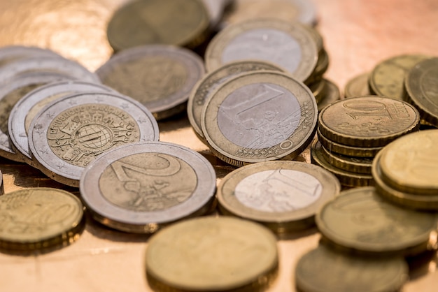 Many euro coin isolated on gold close up