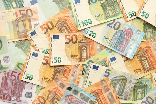 Photo many european euro money bills lot of banknotes of european union currency close up