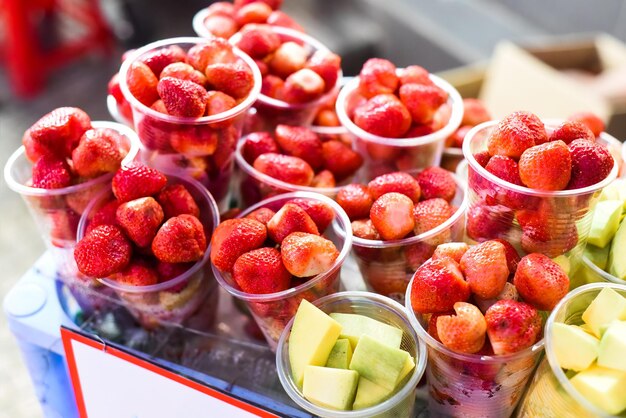 Many fresh natural strawberry and apple in vietnamese night market in Da Lat