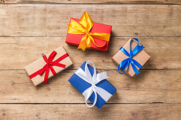 Many gift boxes on wooden background. Holiday concept