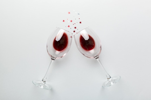 Many glasses of red wine at wine tasting Concept of red wine on colored background Top view flat lay design