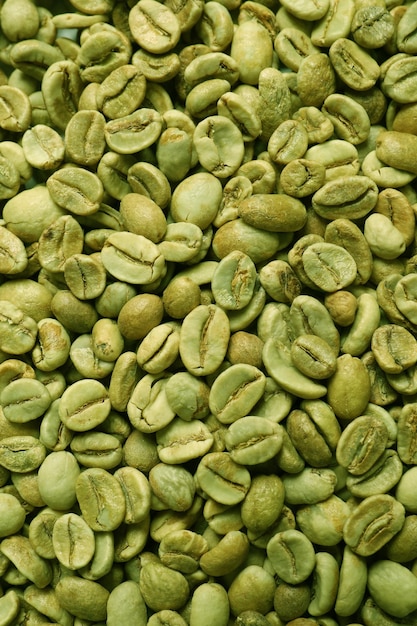 Photo many green coffee beans as background top view