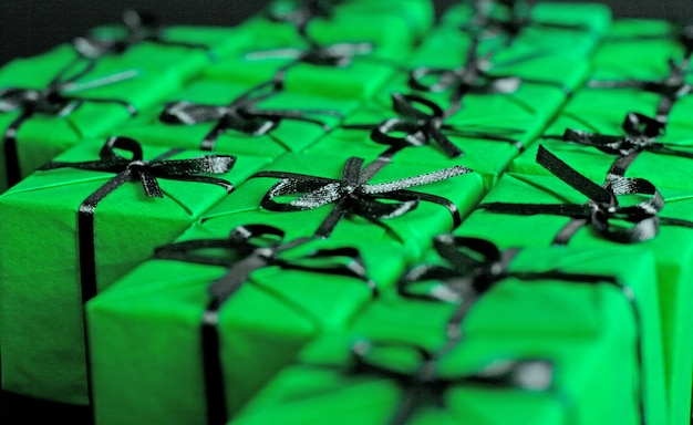 Many green gift boxes closeup