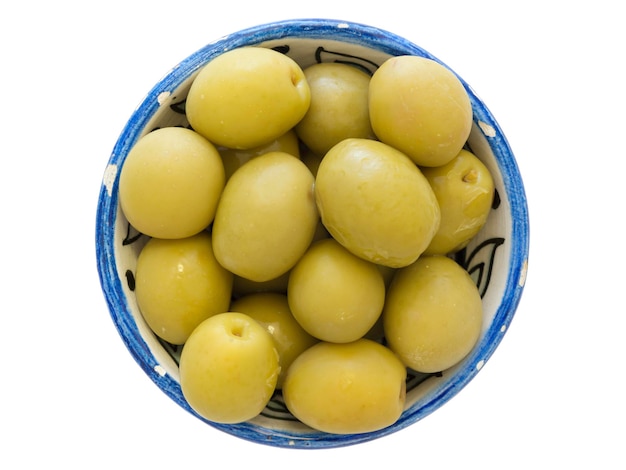 Many green olives in small blue cup isolated on white