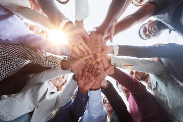 Many hands together group of joining hands