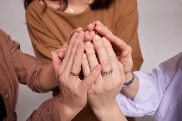 Many hands trying to reach and catch something