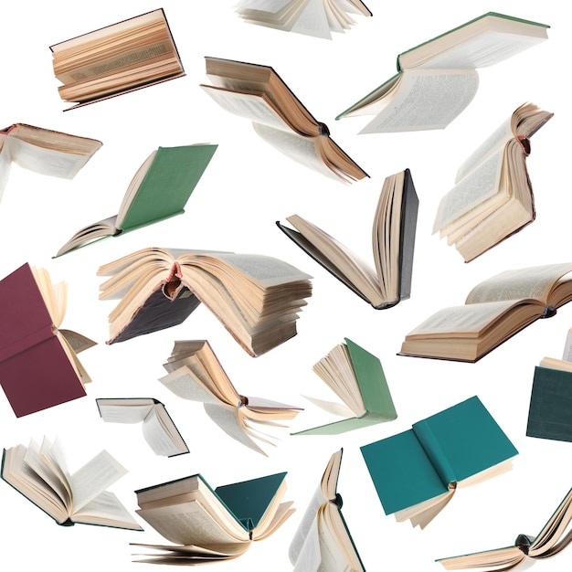 Many hardcover books falling on white background