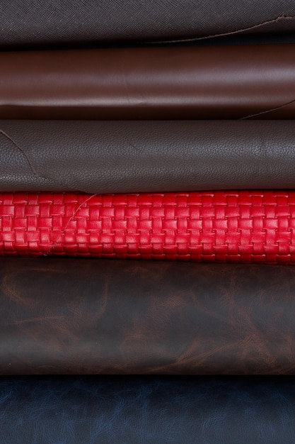 Many horizontal pieces of colored leather for sale in the whole