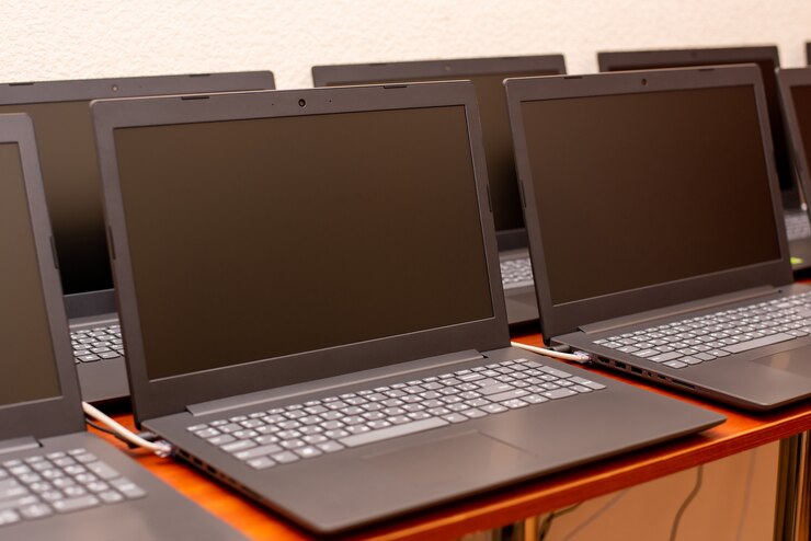 Many laptops are on the table. computer exhibition demonstration. it technology
