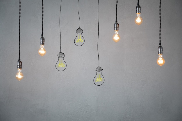 Many light bulbs against concrete wall surface