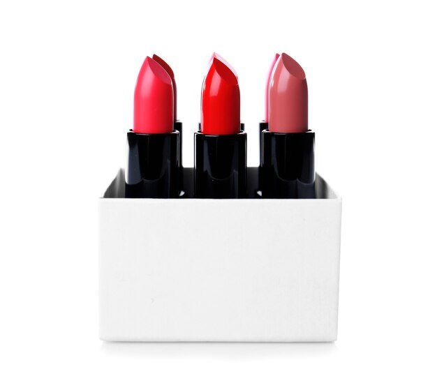 Many lipsticks in box on white