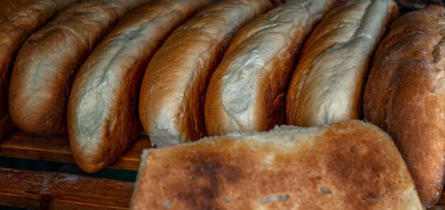 Many loaves of white bread on the counter Traditional food Closeup