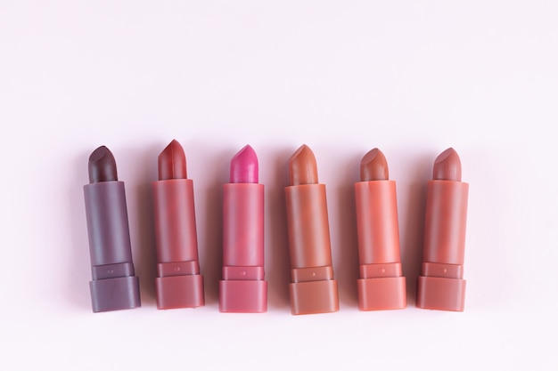 Many matte lipstick background top view