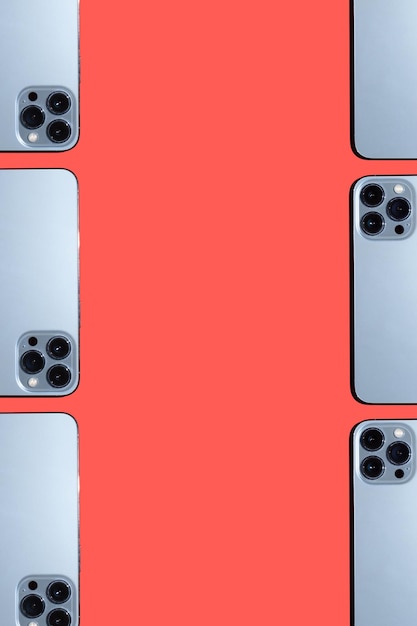 Many modern phones on a red background