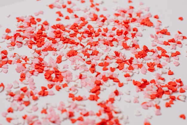 Many multicolored sugar hearts on a white background. Valentine's day concept.