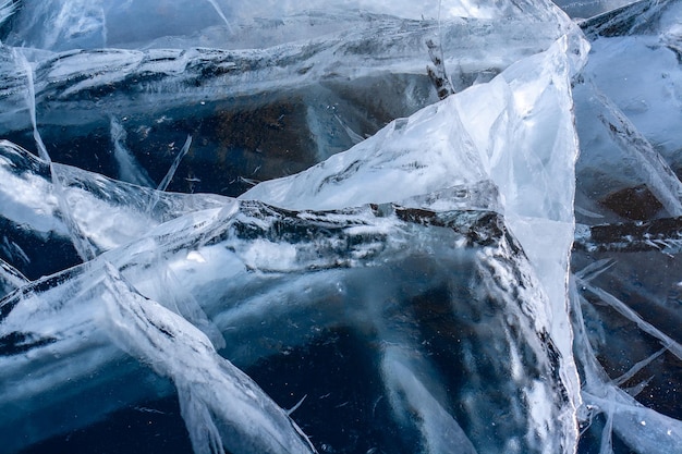 Many natural deep cracks in the ice of Lake Baikal The structure of ice is visible Horizontal