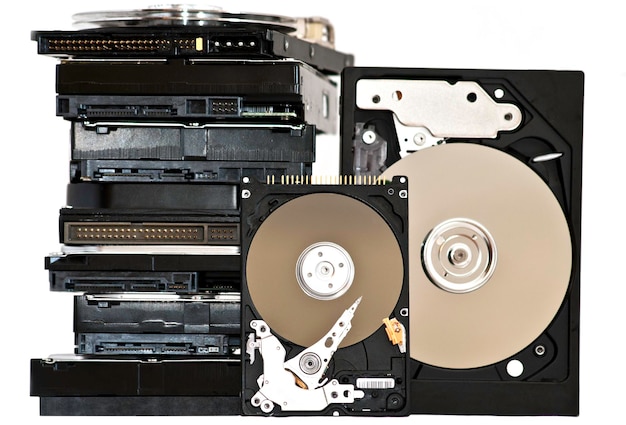 Photo many open hard drives isolated on white background.