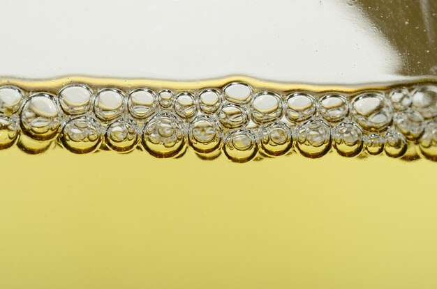 Many pearls of champagne in glass