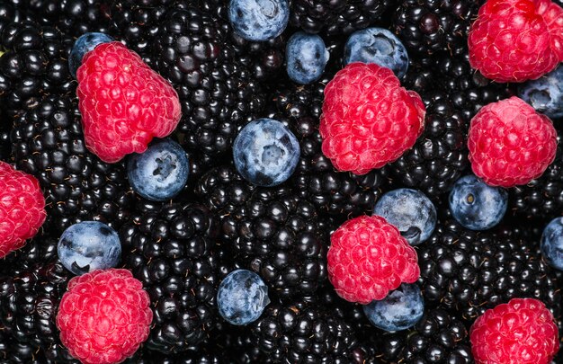 Many raspberries, blackberries, blueberries, of berries