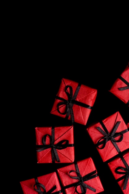 Many red gift boxes on black background