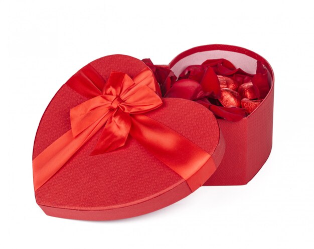 Many rose petals inside open gift box