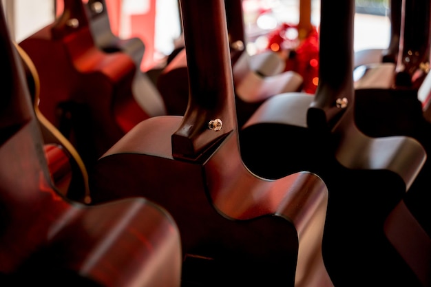 Many rows of classical guitars in the music shop