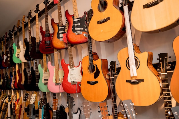 Many rows of classical guitars in the music shop