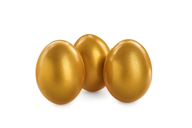 Many shiny golden eggs on white background