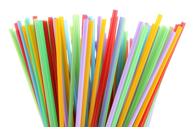 Many straws closeup isolated on white