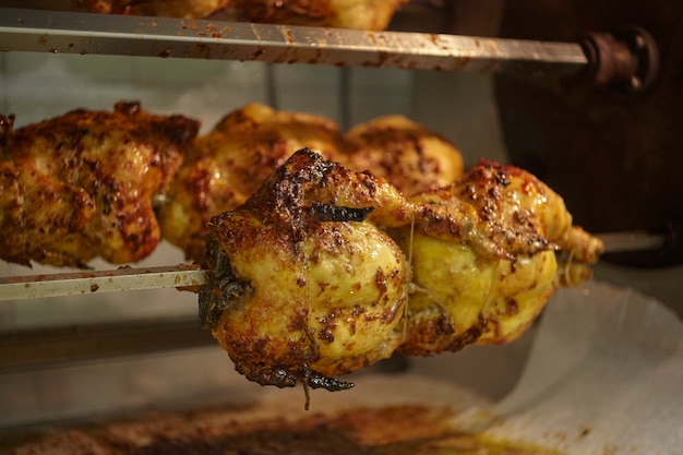 Many Succulent Chickens are cooked in the rotisseries