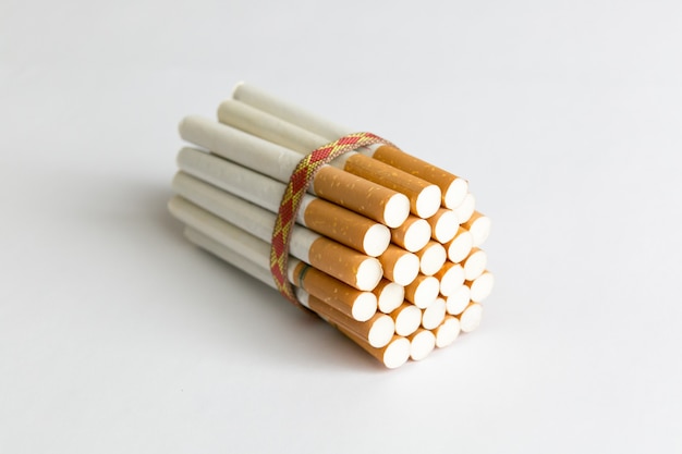 Many tobacco cigarettes tied with a rope