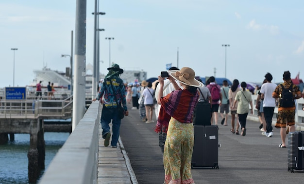 Many tourists Walking and taking pictures at the bridge Pattaya PierxACaptured Pattaya Thailand