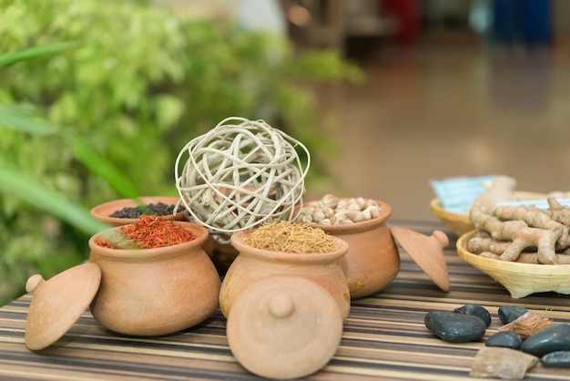 Many types of thai herbs in a clay pot