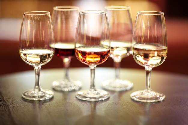 The many varieties of wine Shot of five glasses of different wines on a table