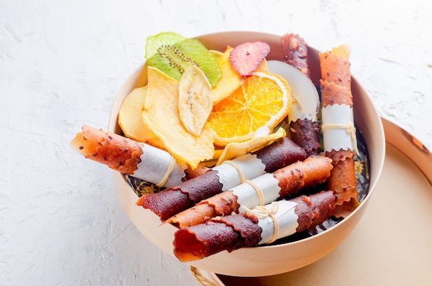 Many varietty of fruits chips in round wooden box