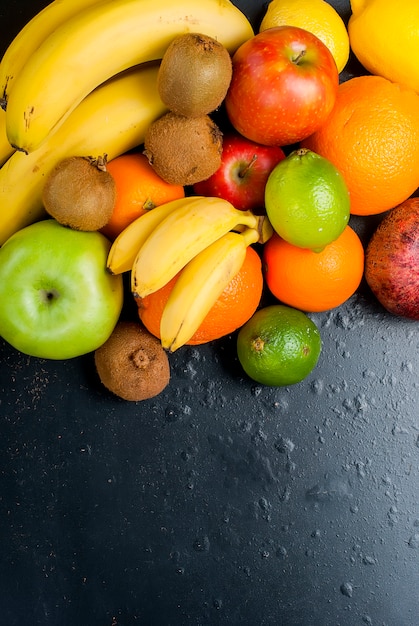 Many various fruits on a black background