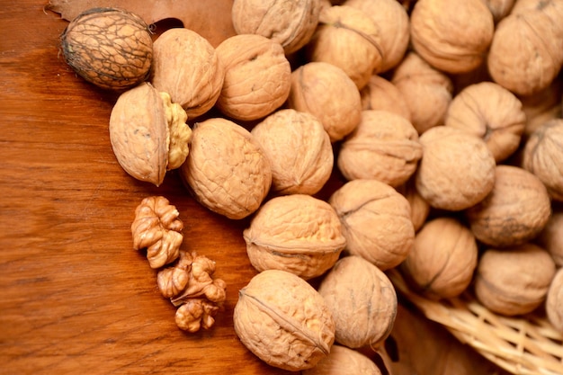 many walnuts in the shell closeup natural background