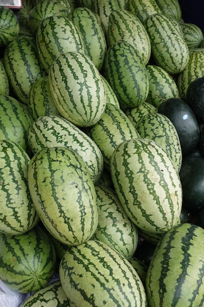 many water melons display for sale at local market