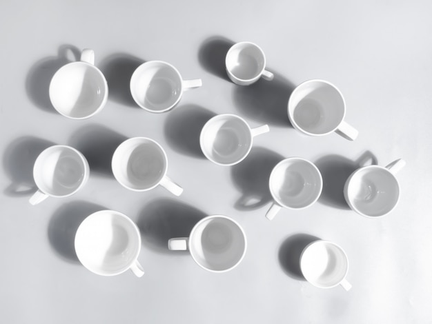 Many white ceramic cups, top view