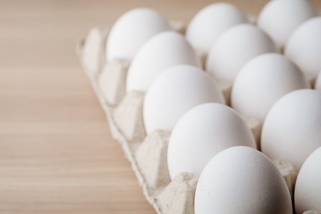 Many white chicken eggs food in tray box