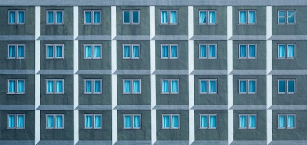 Many windows on the facade of the building