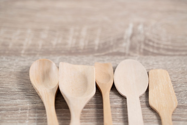 many wood spoons lay on table