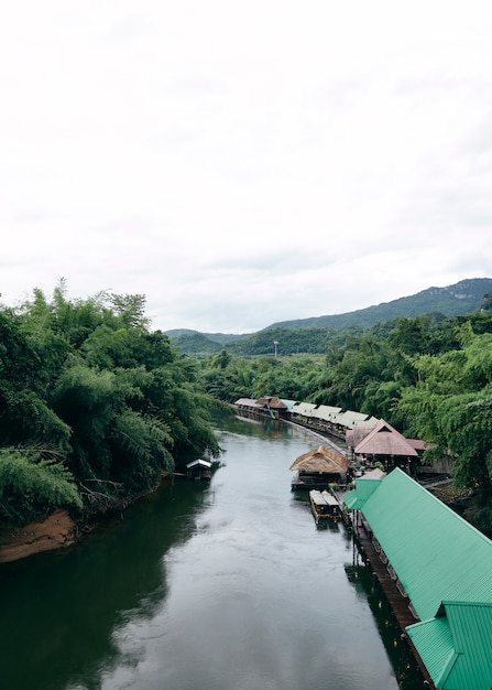 Many wooden house floating on the river