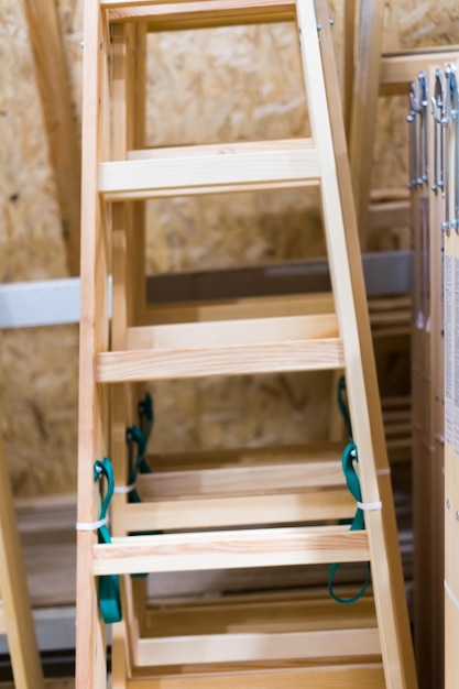 Many Wooden ladders Stack of wooden stairs in a store