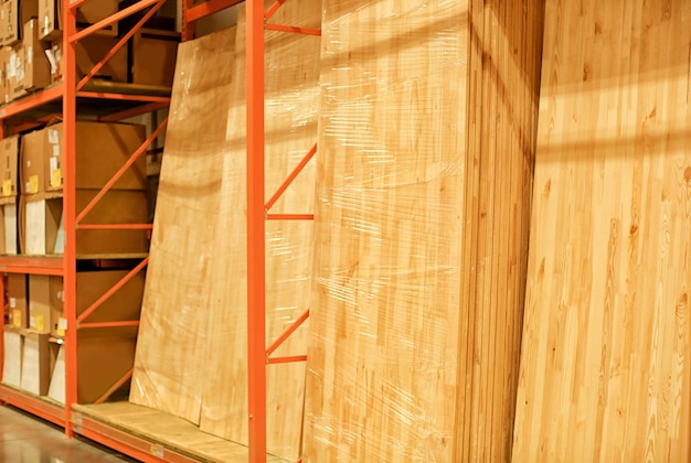 Many wooden panels on rack of storehouse